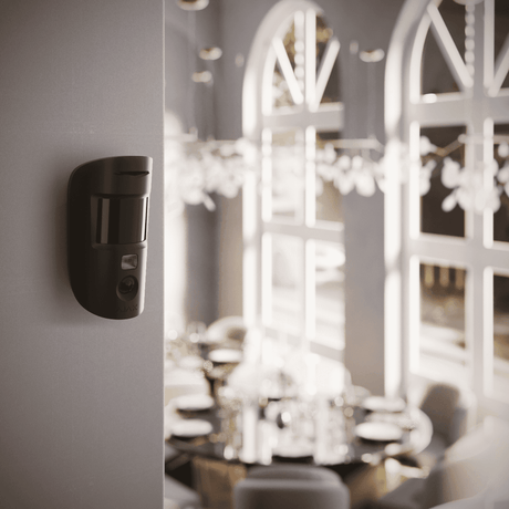 Ajax MotionCam Wireless Motion Sensor with Camera — Black shown in use