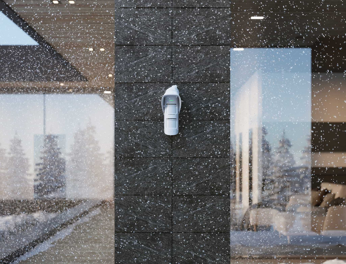 Ajax Hood for MotionProtect Outdoor shown in use